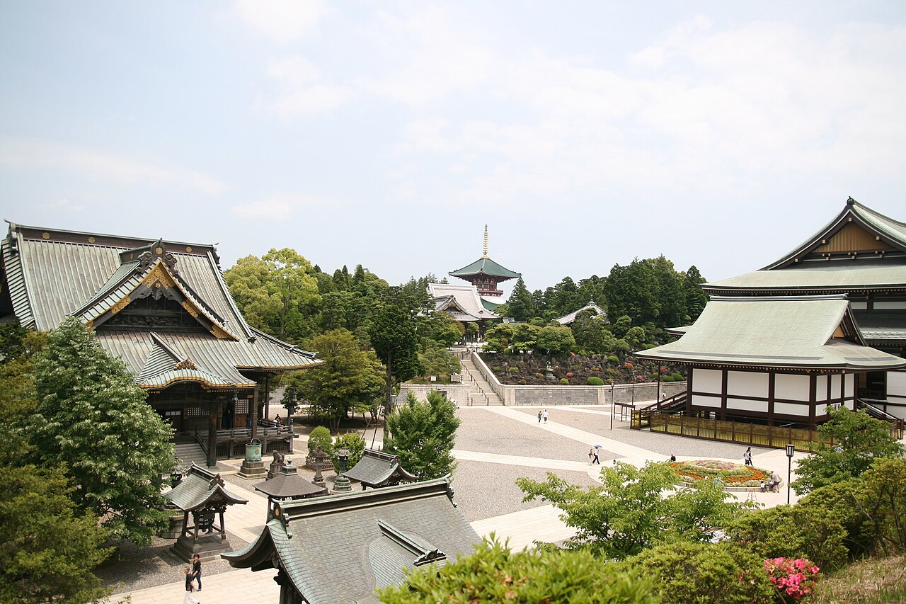Tiled temple halls and a pagoda spread across the wooded grounds of Naritasan Shinshoji in Narita.
