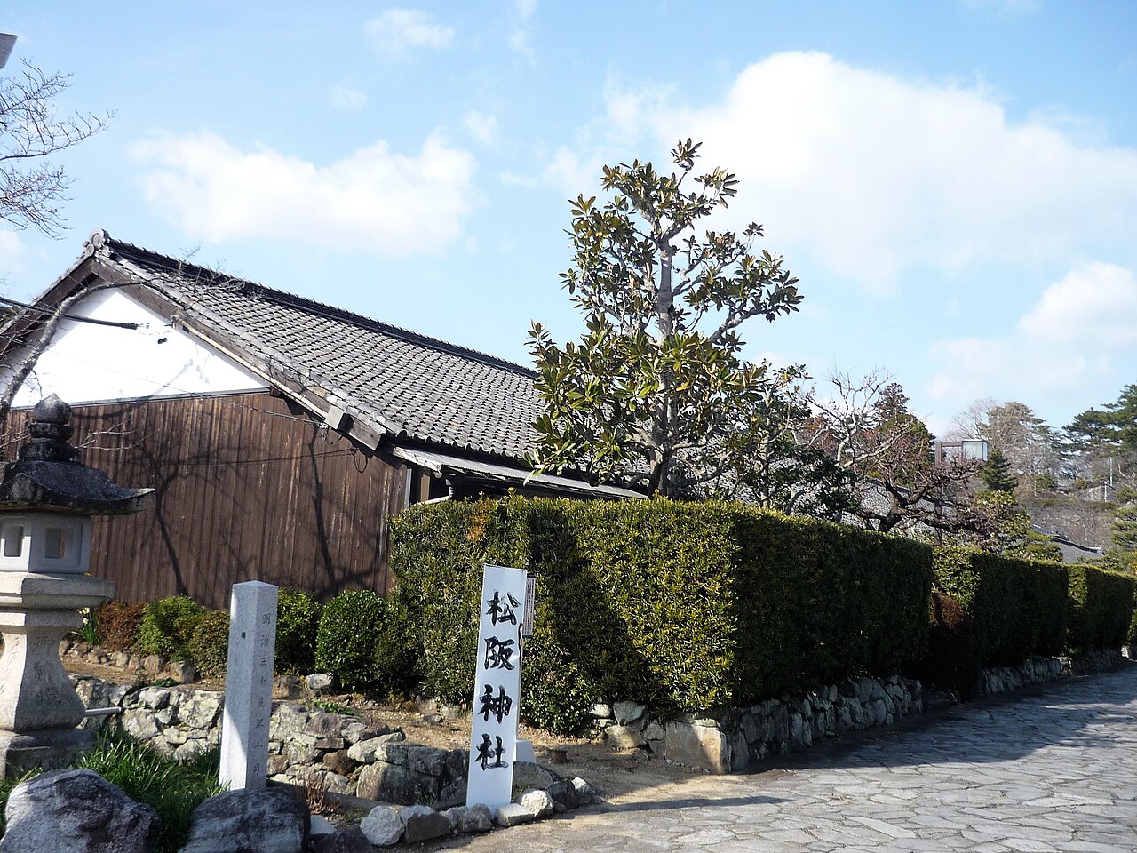 Entrance area of Gojoban Yashiki near Matsusaka Shrine, with a stone lantern and hedge, Matsusaka