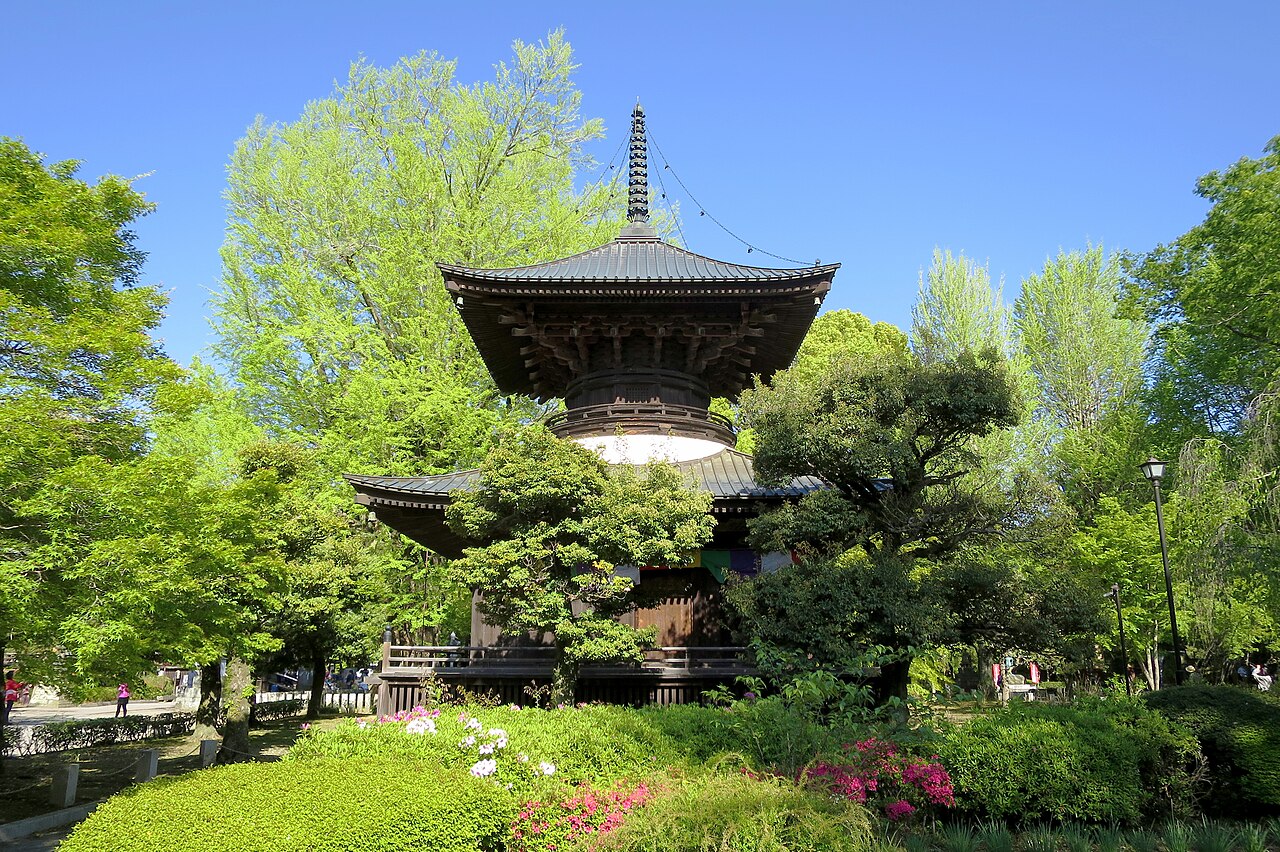 The tahoto pagoda of Banna-ji surrounded by fresh green leaves and azaleas