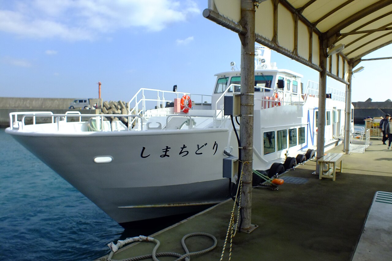 The white passenger boat Shimachidori moored at a covered pier