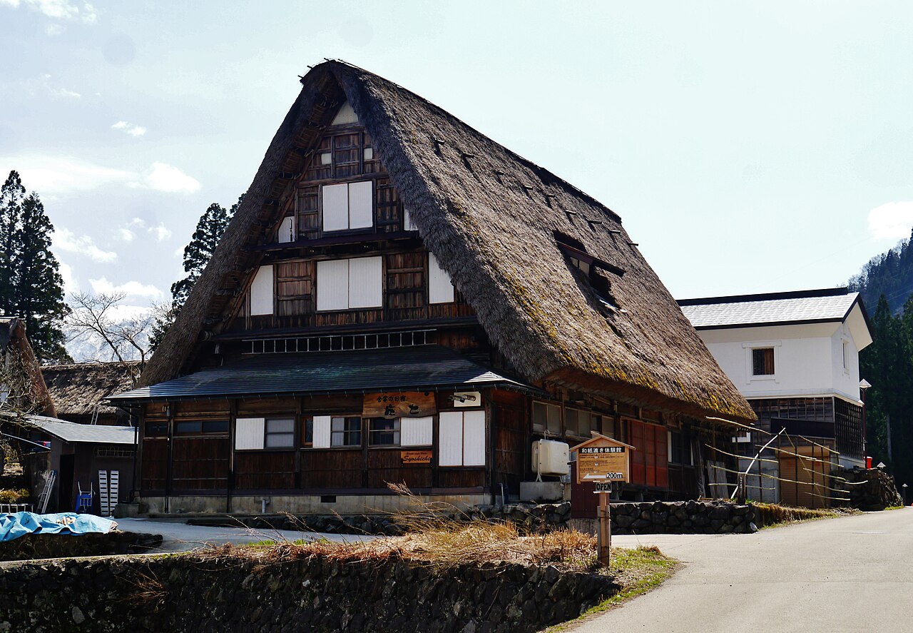 Close view of a steep thatched gassho-zukuri roof in Ainokura village