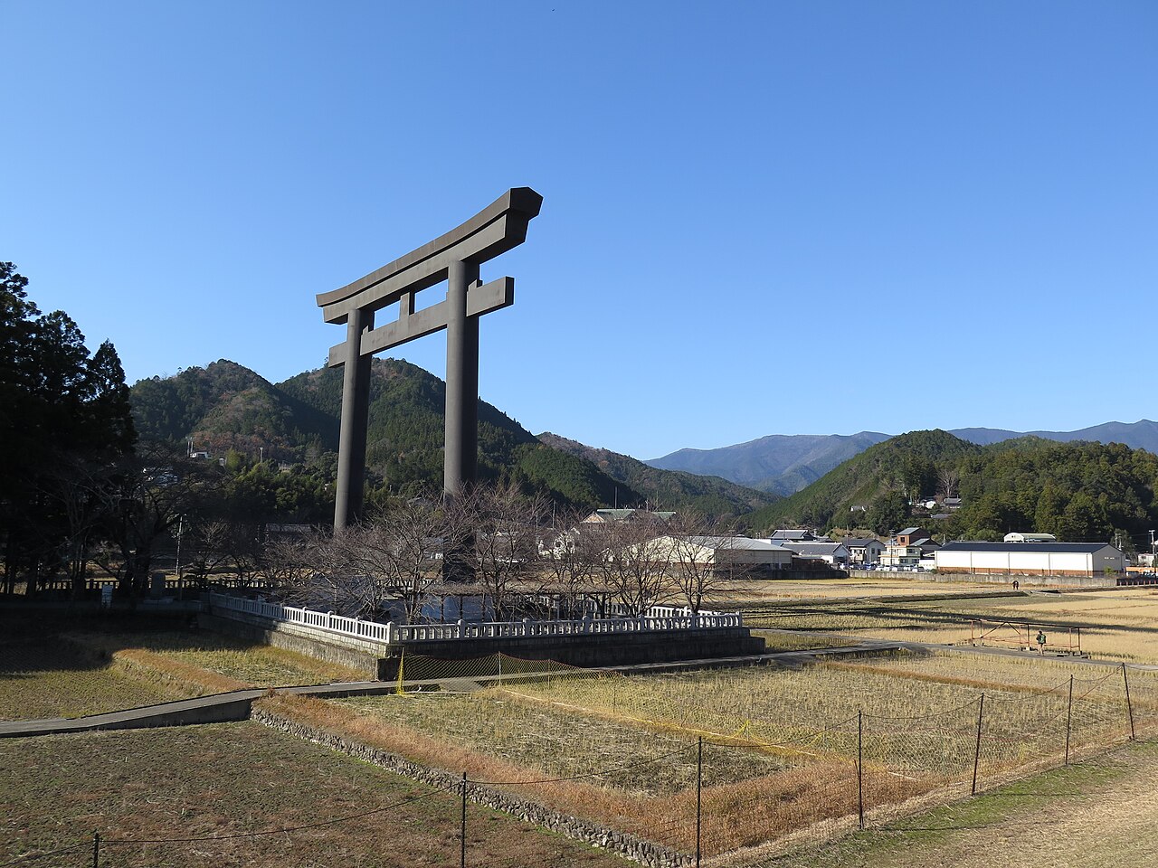 Giant torii gate standing at Oyunohara with mountains behind
