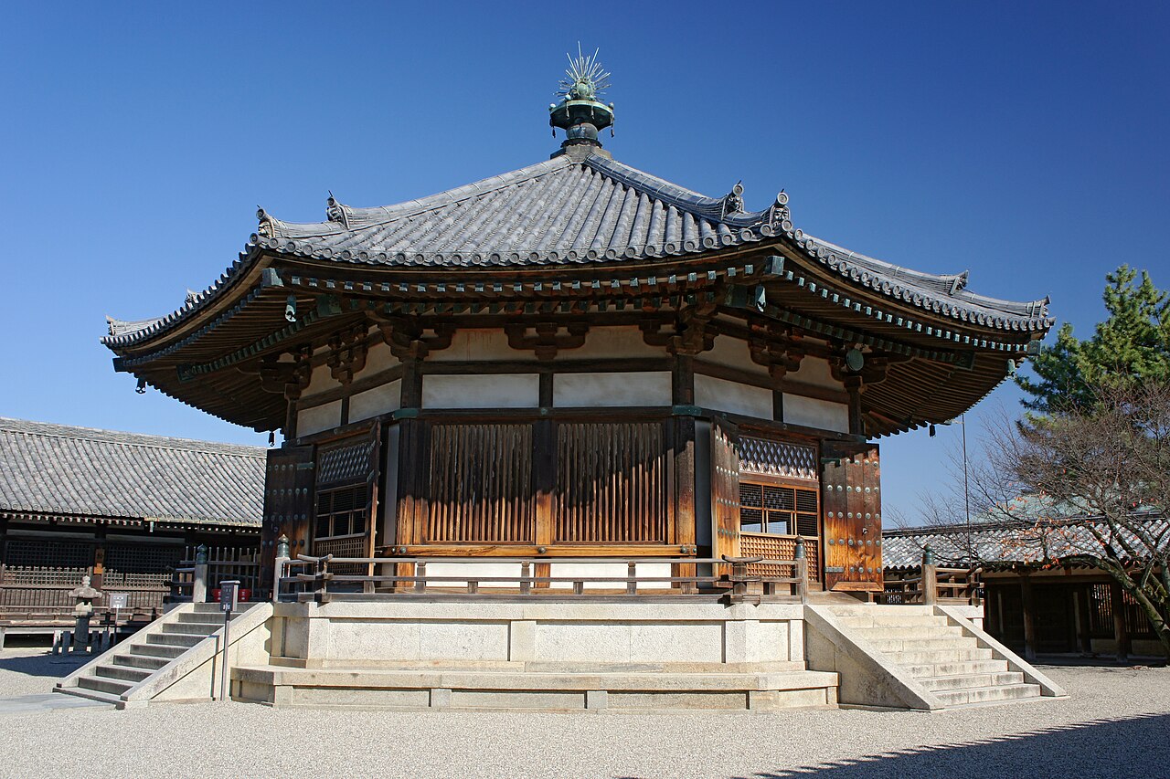 The octagonal Yumedono hall of the eastern precinct, its tiled roof rising to a single bronze finial above a raised stone platform