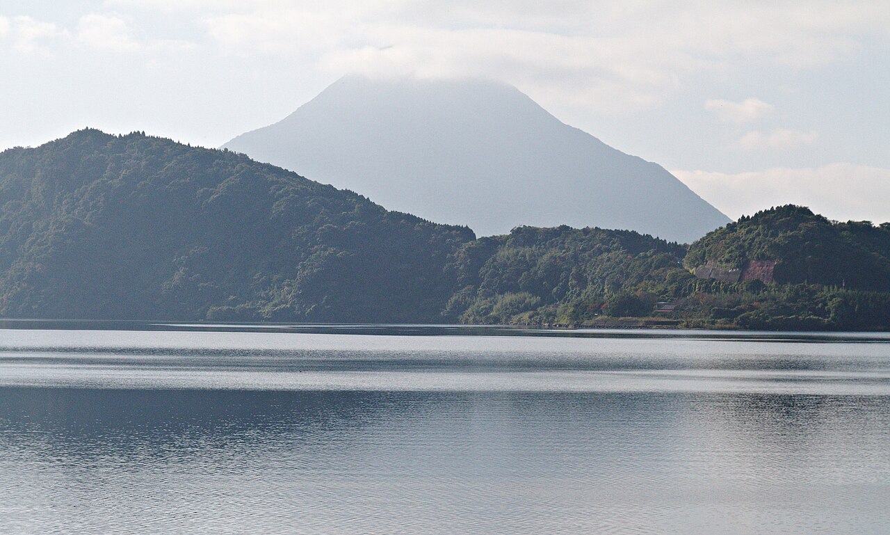 Lake Ikeda with hills beyond and Kaimondake under cloud