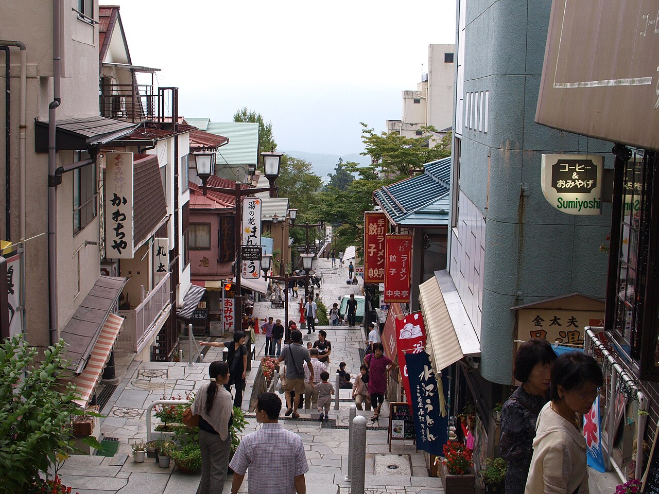 Looking down the stone steps street of Ikaho Onsen, lined with souvenir shops on both sides.