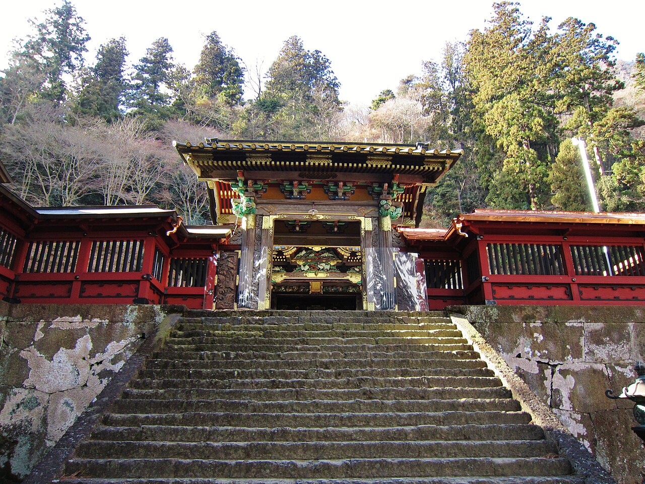 Karamon, the ornately carved vermilion gate partway up Myogi Shrine's stone stairway