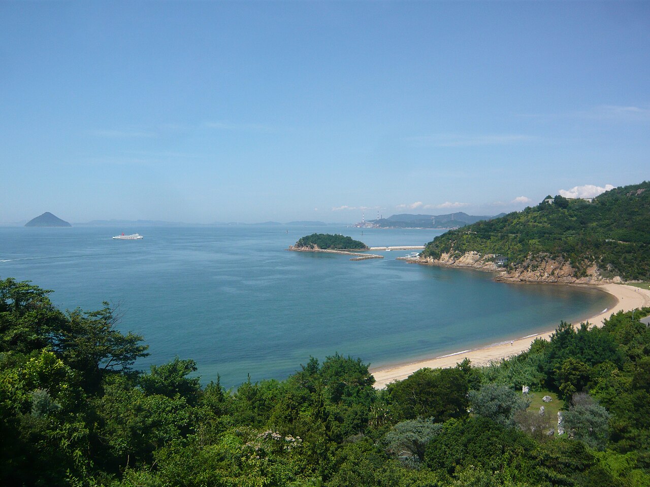 A view west over the Seto Inland Sea and a sandy beach from the hillside near Benesse House on Naoshima