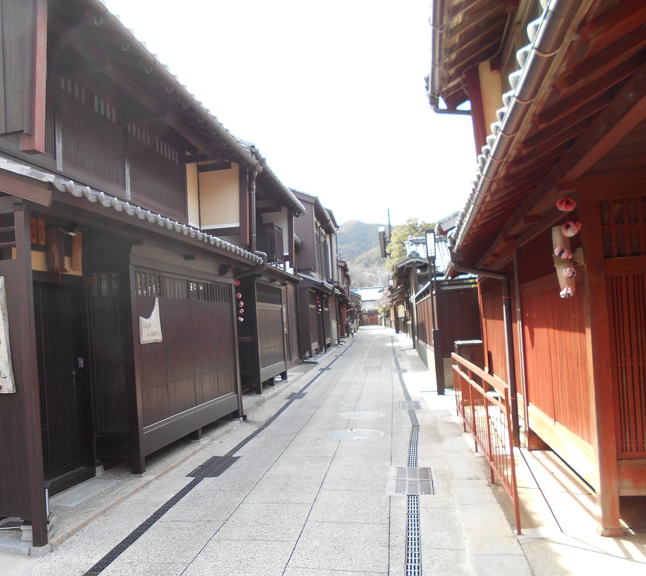 Narrow paved lane in Sanchomachi, Obama Nishigumi, lined with wooden townhouses with latticed doors