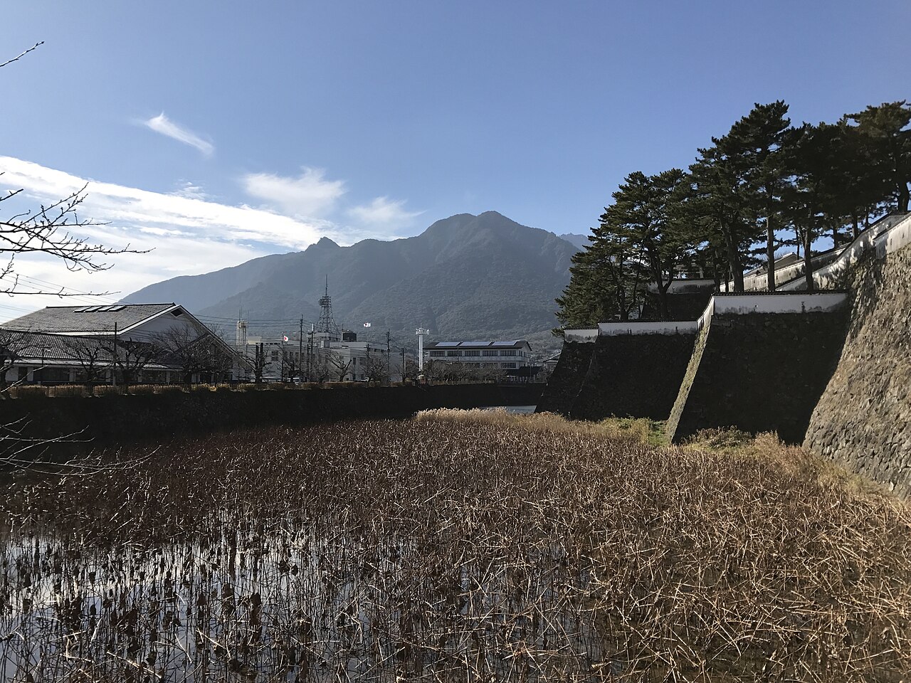 The moat of Shimabara Castle with Mt. Mayuyama rising behind it