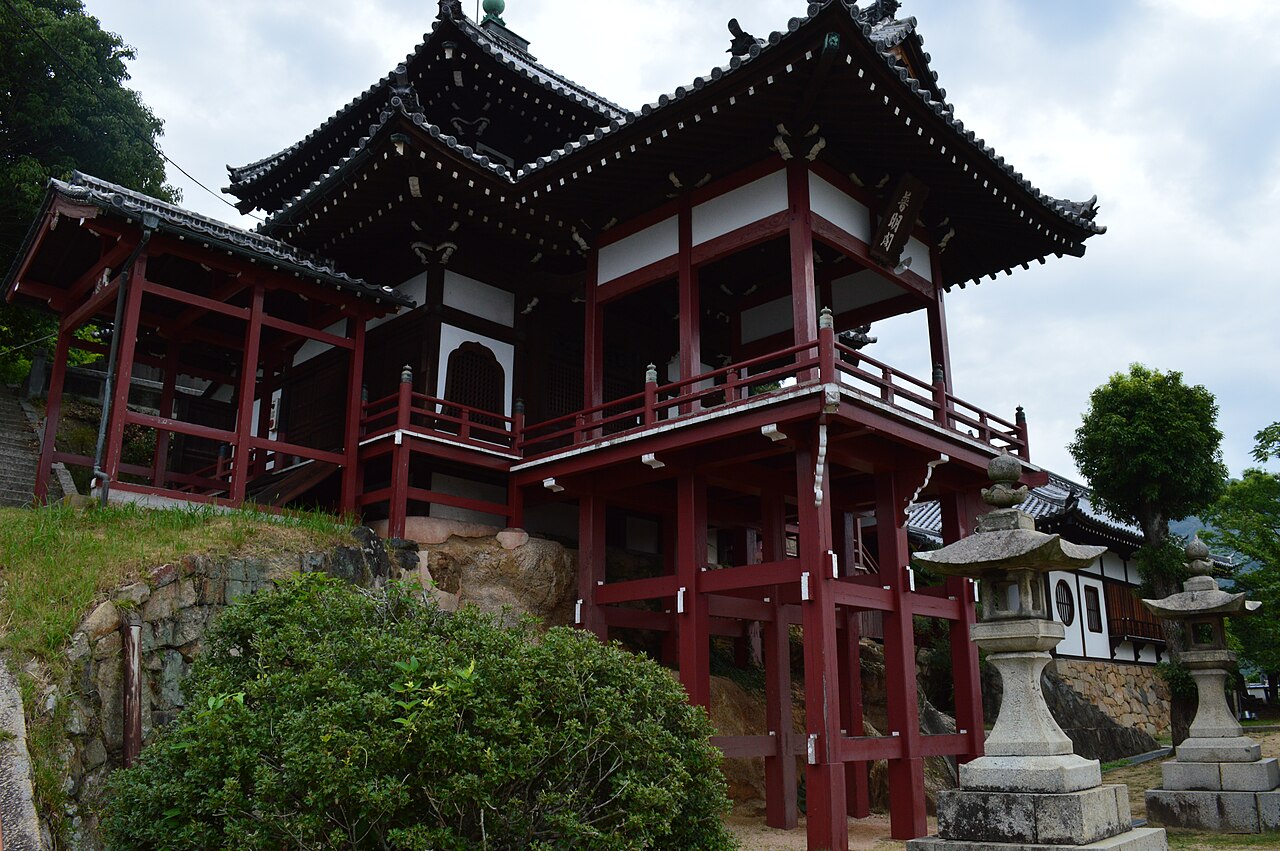 Fumeikaku, an elevated red-pillared hall of Saihoji Temple overlooking Takehara's old town
