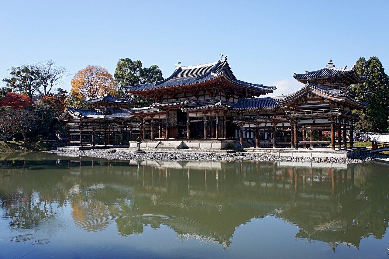 The Phoenix Hall of Byodoin reflected in the still pond on a clear day