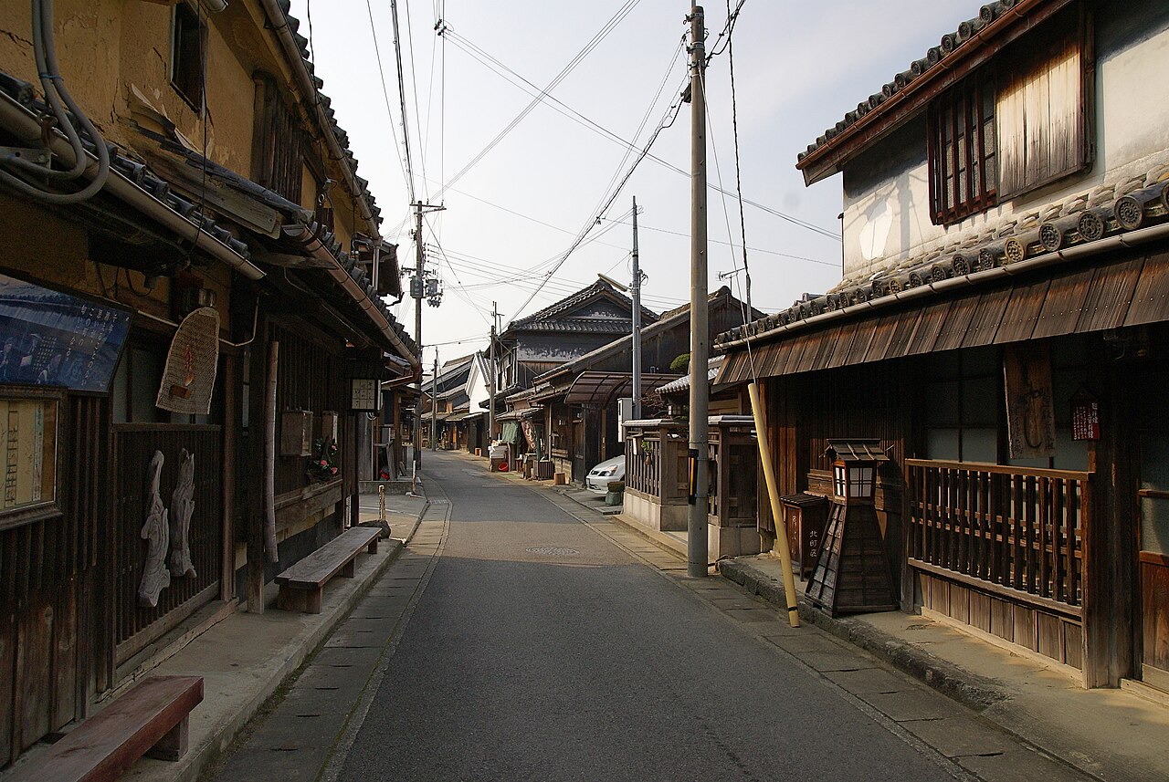 Narrow street lined with old wooden merchant houses with lattice windows in the Yuasa preserved district