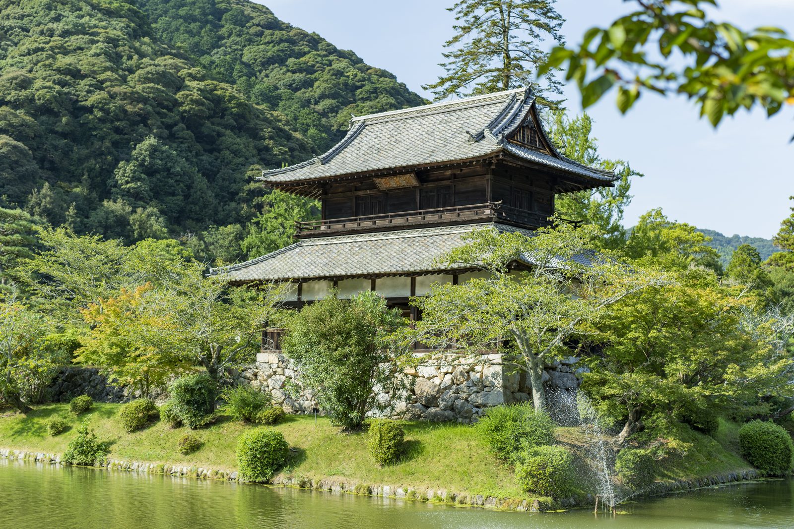 Kinunkaku Hall in Kikko Park above its stone wall and moat
