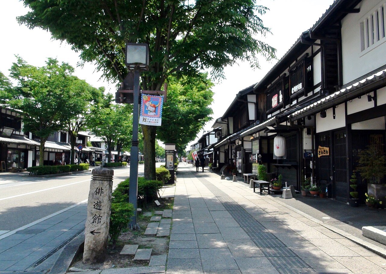 The timbered shopfronts of Yume Kyobashi Castle Road in the old town below the castle.
